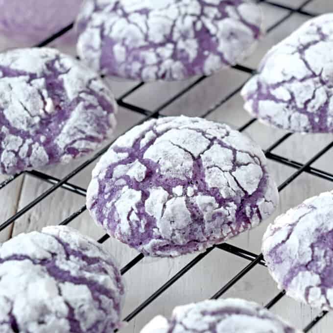 Ube Crinkle Cookies on a wire rack