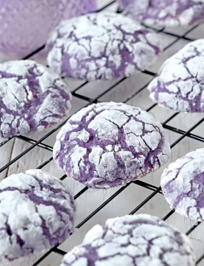 Ube Crinkle Cookies on a wire rack