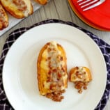 saba bananas stuffed with ground pork and fried until golden on a white plate