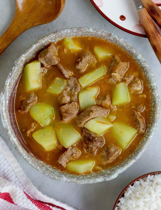 Picadillo Soup in a bowl with steamed rice on the side