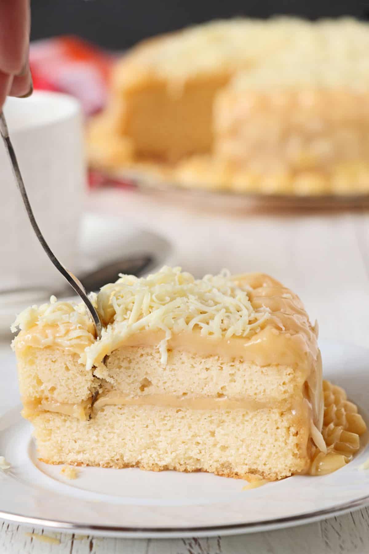 slice of yema cake on a serving plate