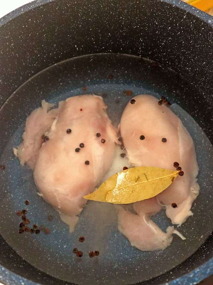 poaching chicken breast in a pot