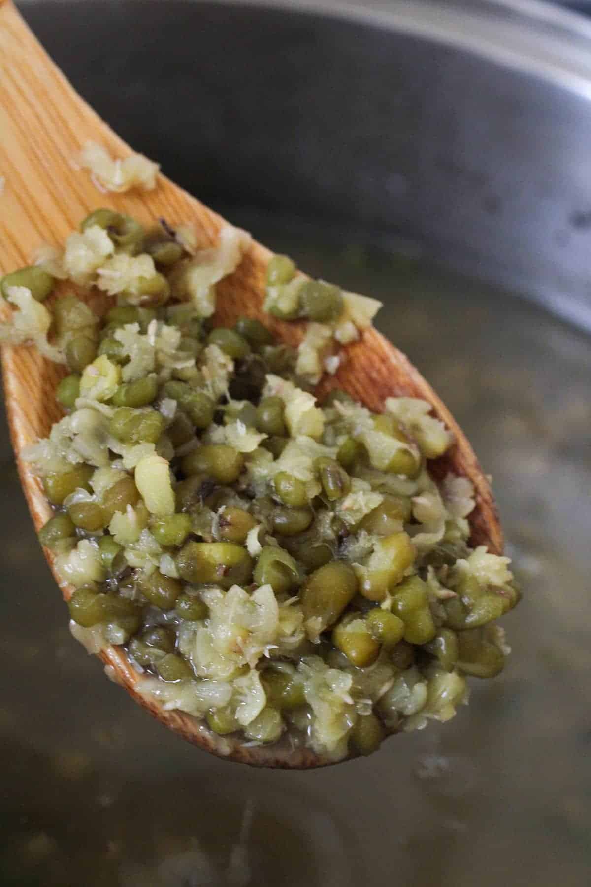 boiled mung beans in a pot to make ginisang munggo