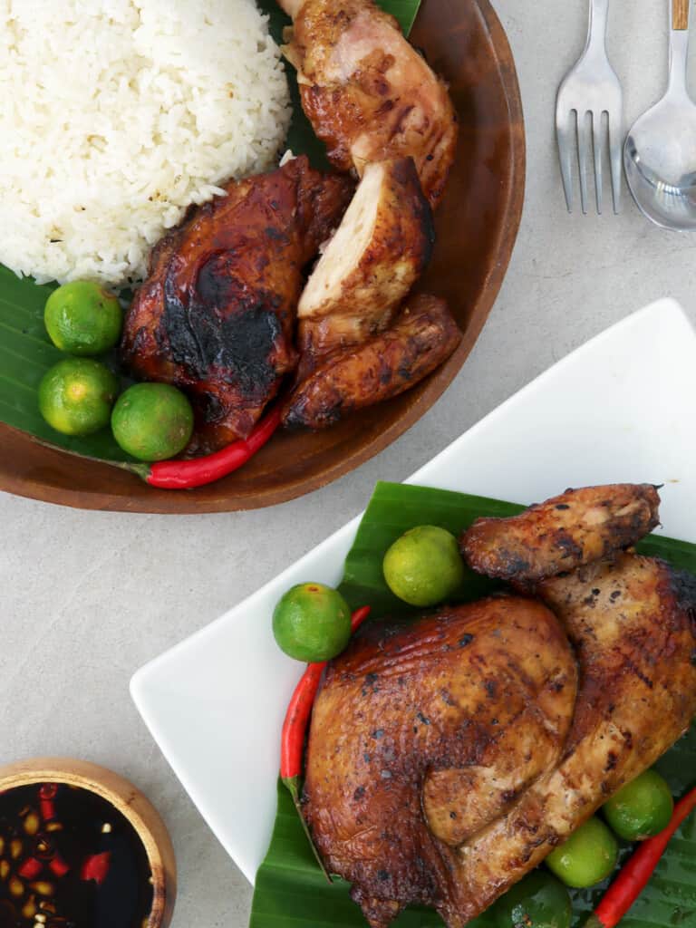 cut-up Filipino chicken barbecue with steamed rice on a plate