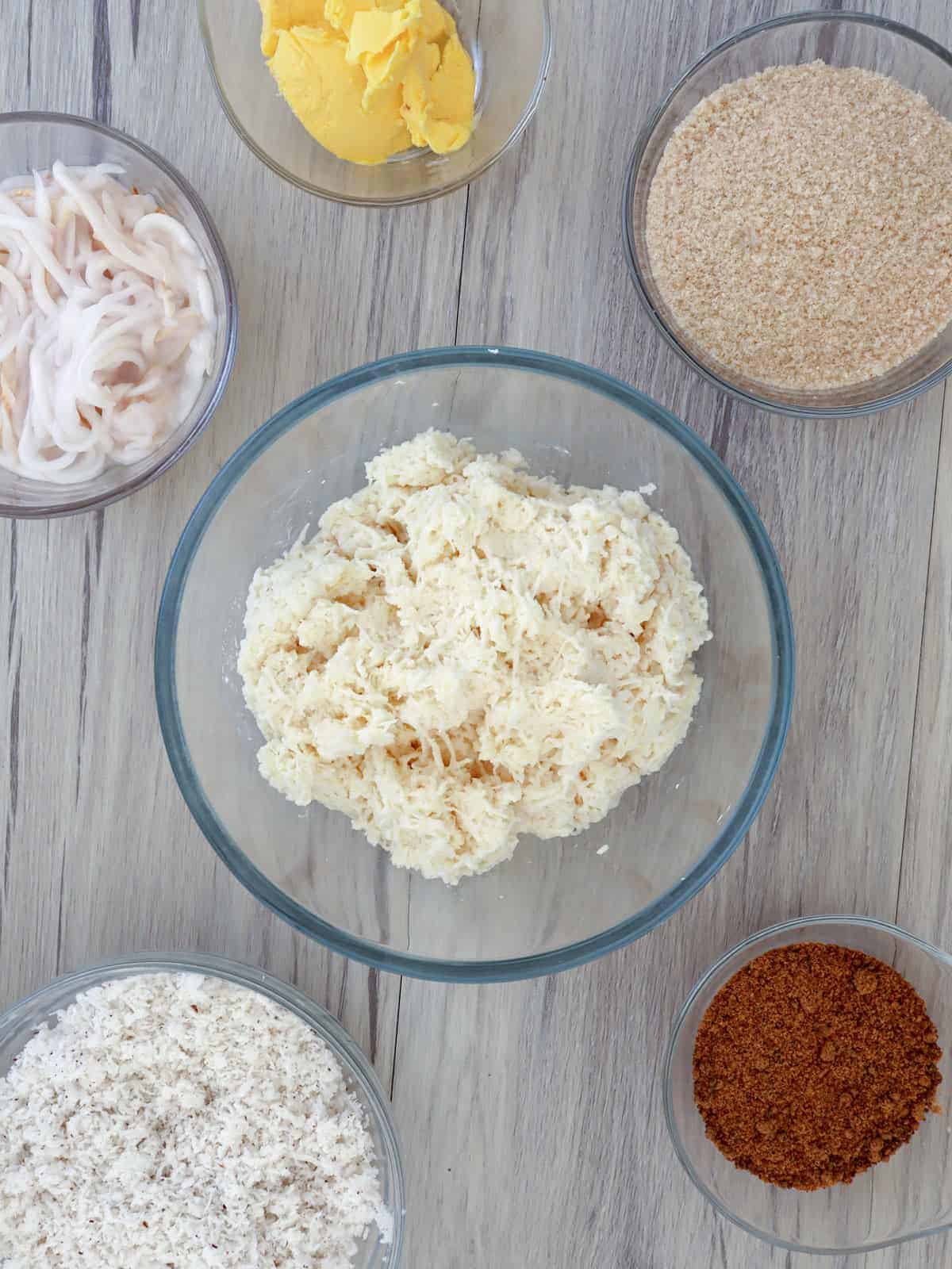 grated cassava, brown sugar, shredded buko, grated coconut, sugar, margarine in individual bowls