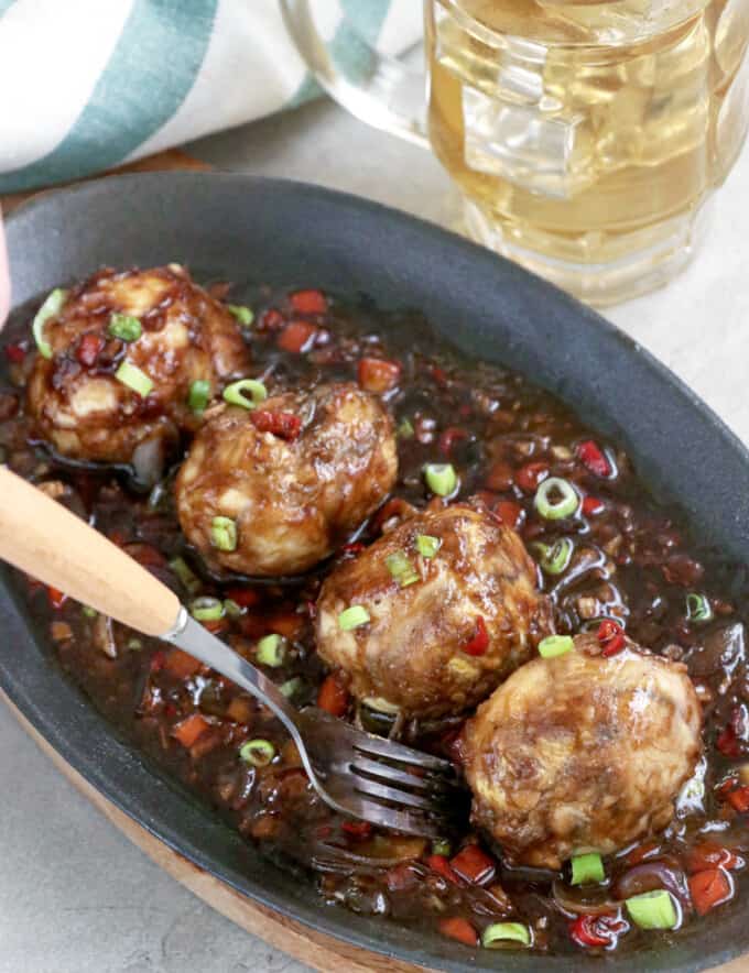 balut served sizzling style in a spicy and savory sauce