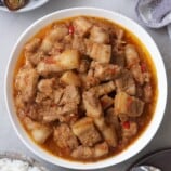 pork binagoongan in a white bowl