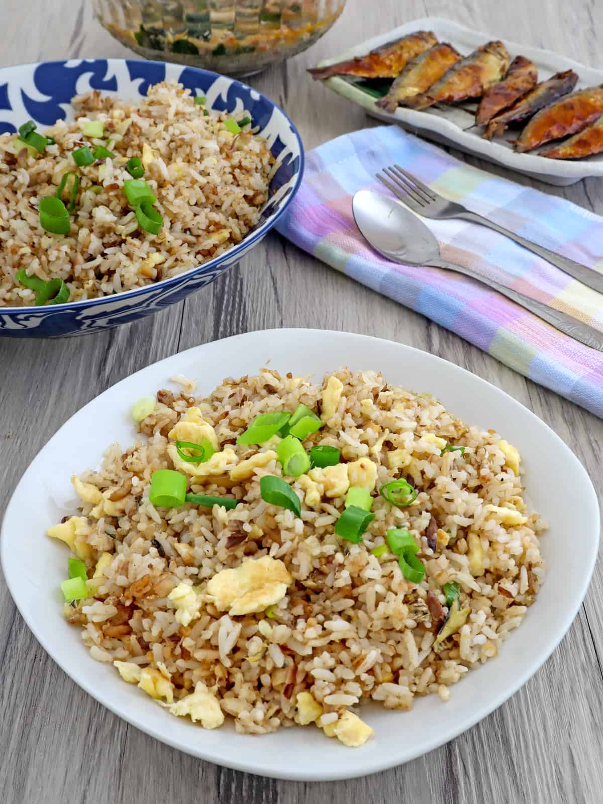 Fried Rice with tinapa flakes on a white serving plate