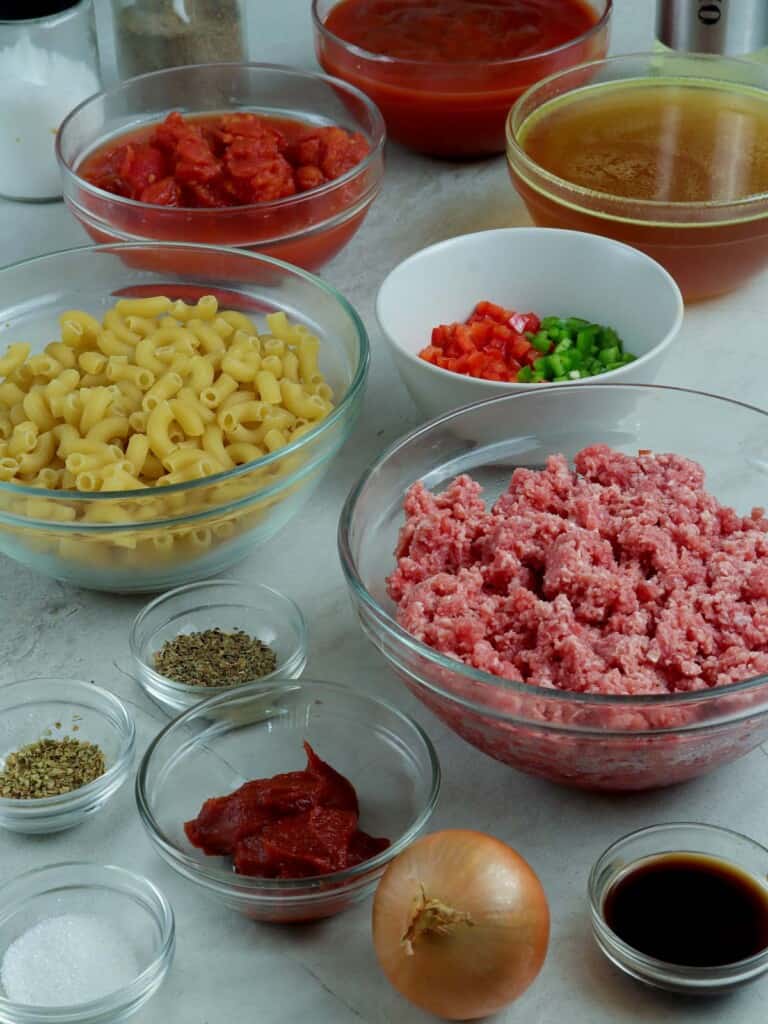 ground beef, dry elbow macaroni, tomato paste, crushed tomatoes, beef broth, bell peppers, onion,  seasonings