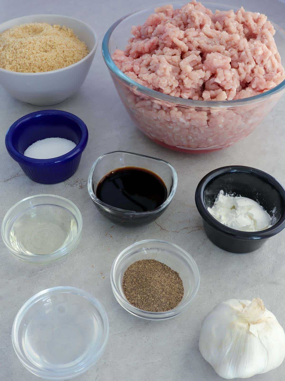 ground pork, salt, pepper, garlic, brown sugar, cornstarch, soy sauce, oil, water in bowls