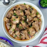 Steamed Spareribs with Black Beans in a white serving bowl