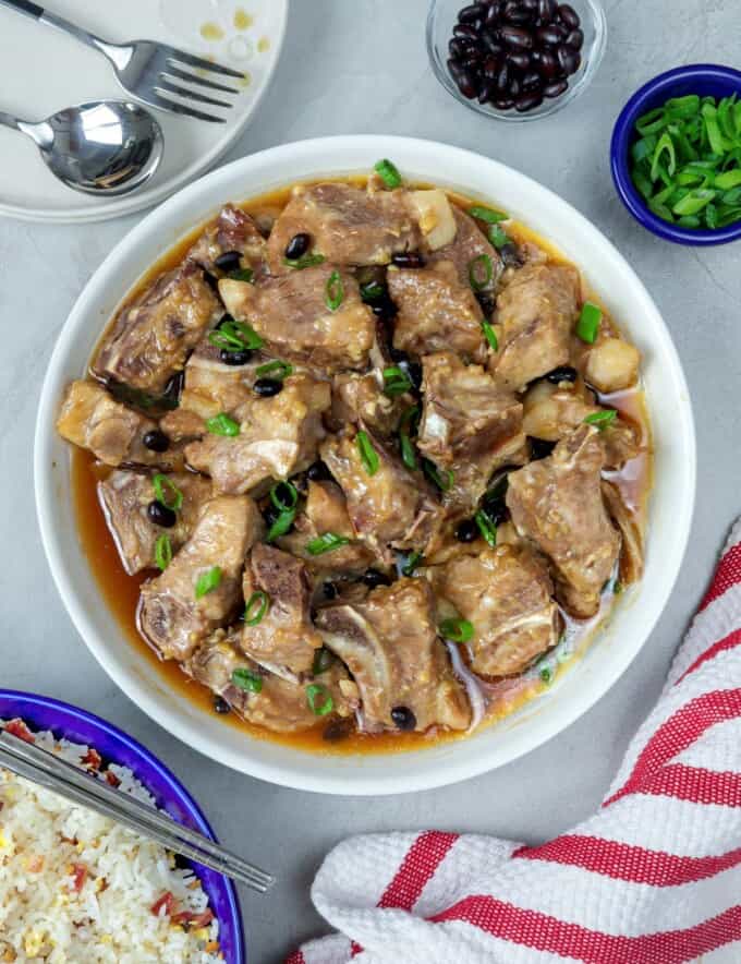 Steamed Spareribs with Black Beans in a white serving bowl