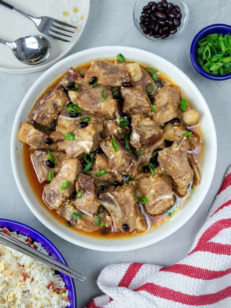 Steamed Spareribs with Black Beans in a white serving bowl