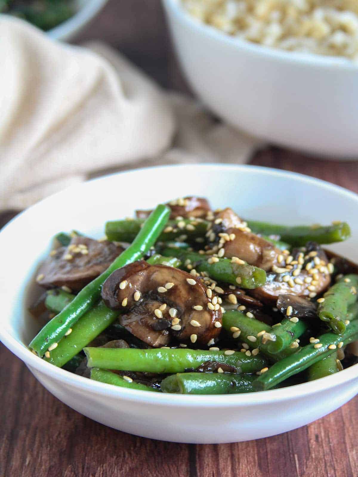 Asian Green Bean Mushroom Stir-fry in a white bowl