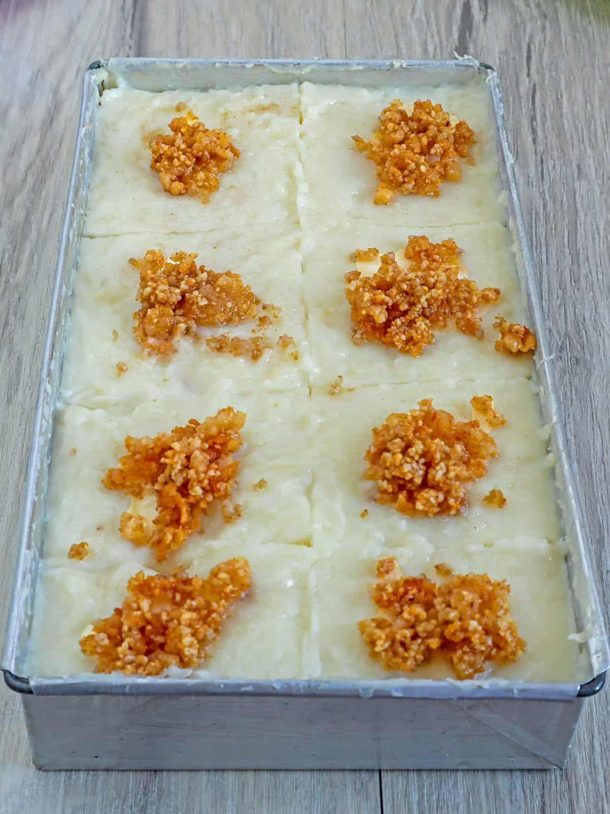 Kapampangan Tibok-tibok with latik topping on a metal dish