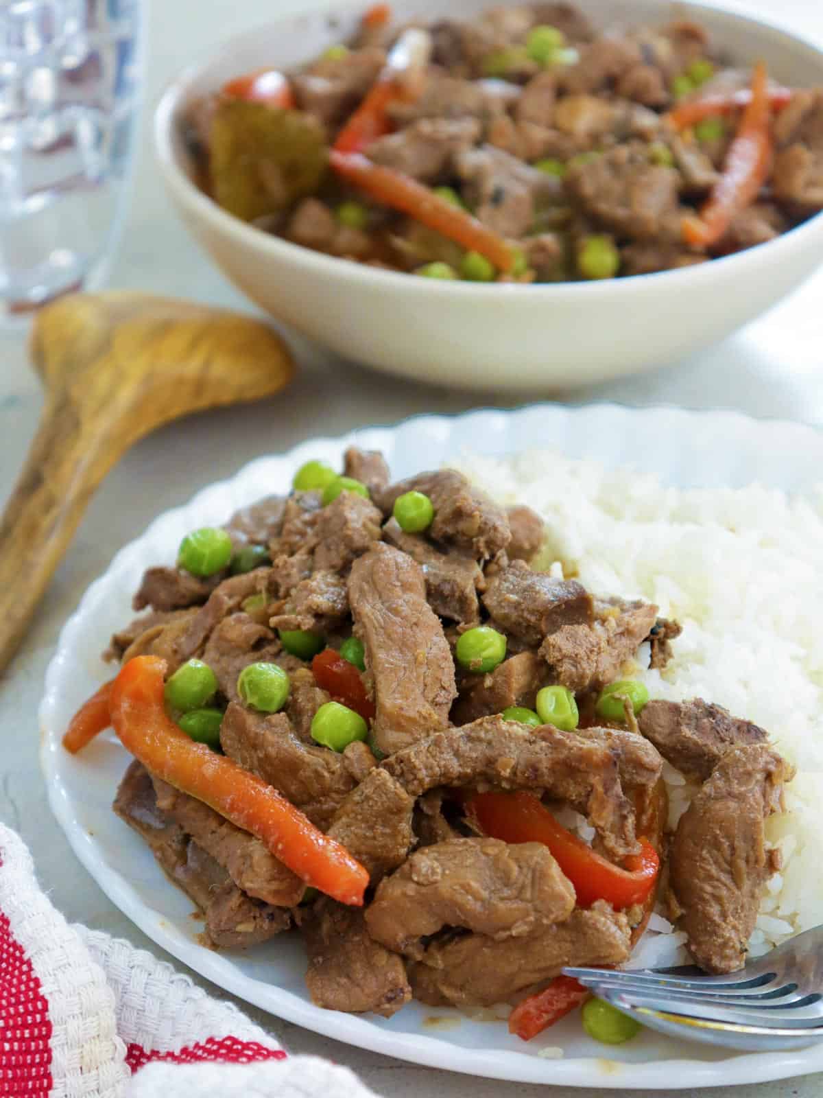 pork and liver stew with steamed rice on a plate