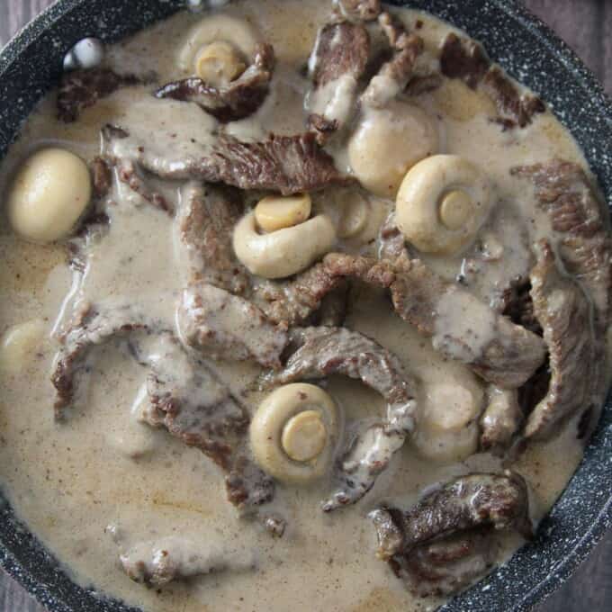 creamy beef and mushrooms in a skillet