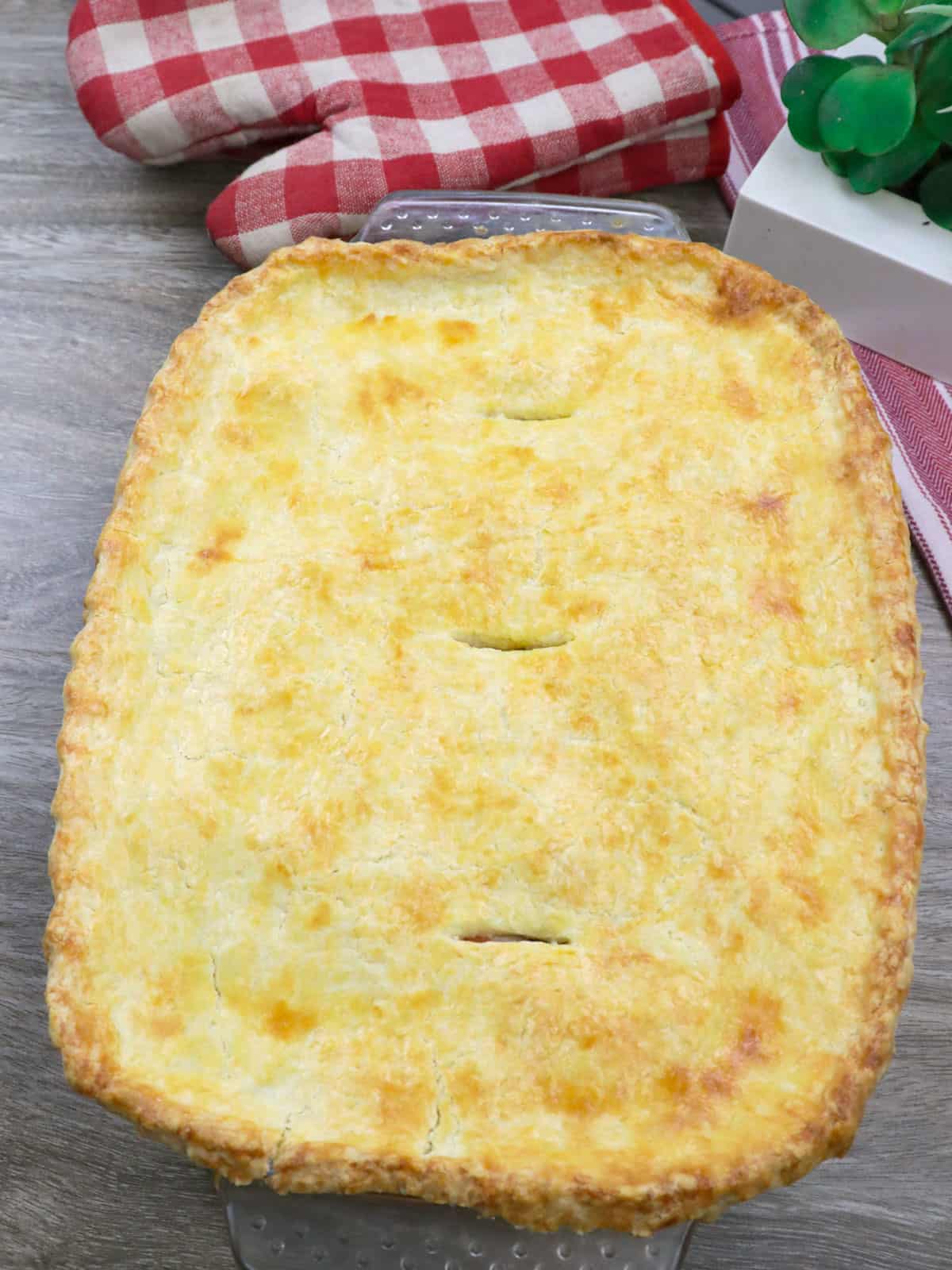 freshly baked Chicken Pastel with pie crust.