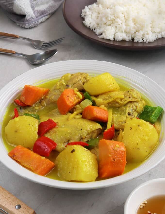 coconut chicken curry on a white serving plate