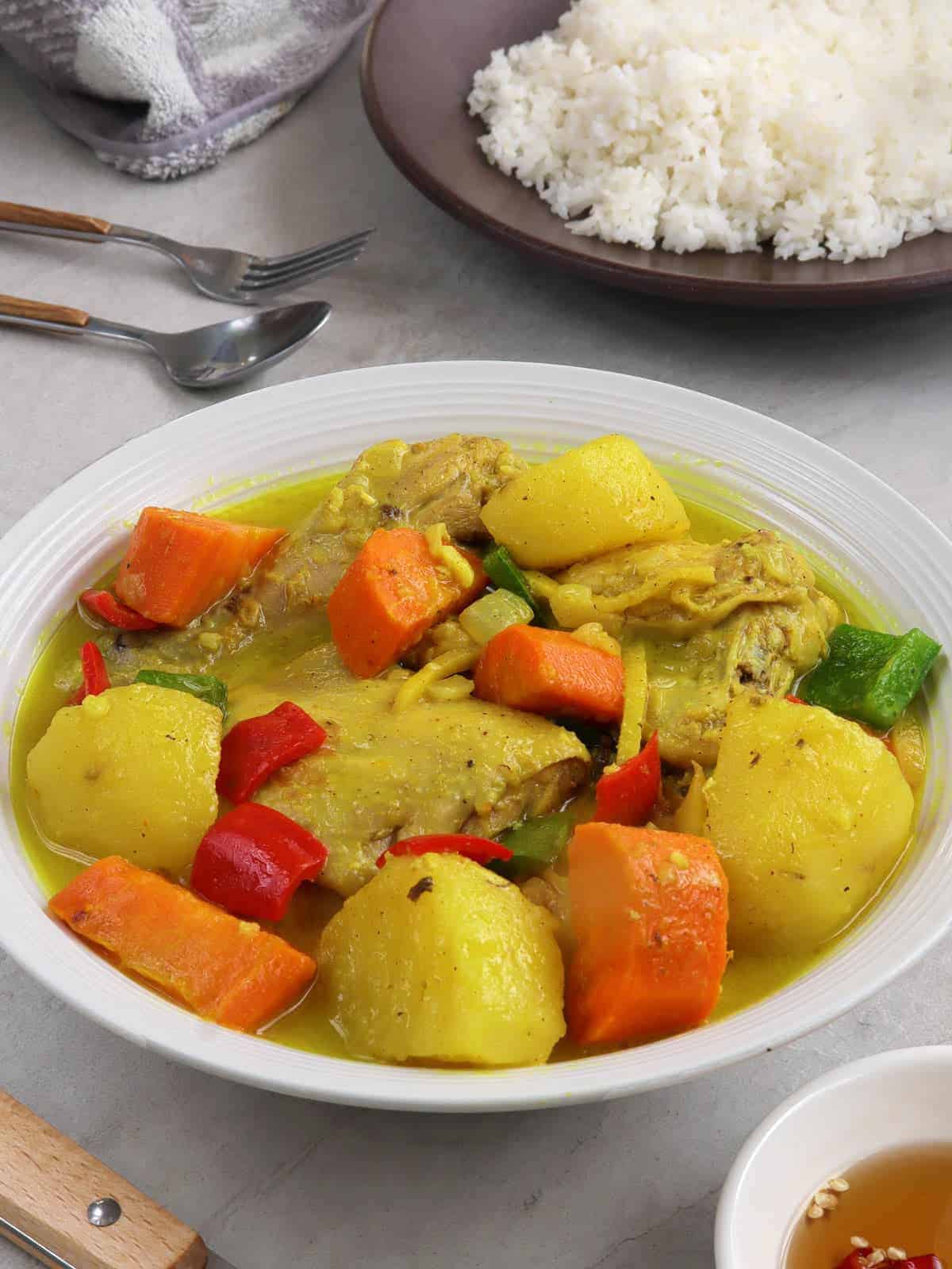 coconut chicken curry on a white serving plate