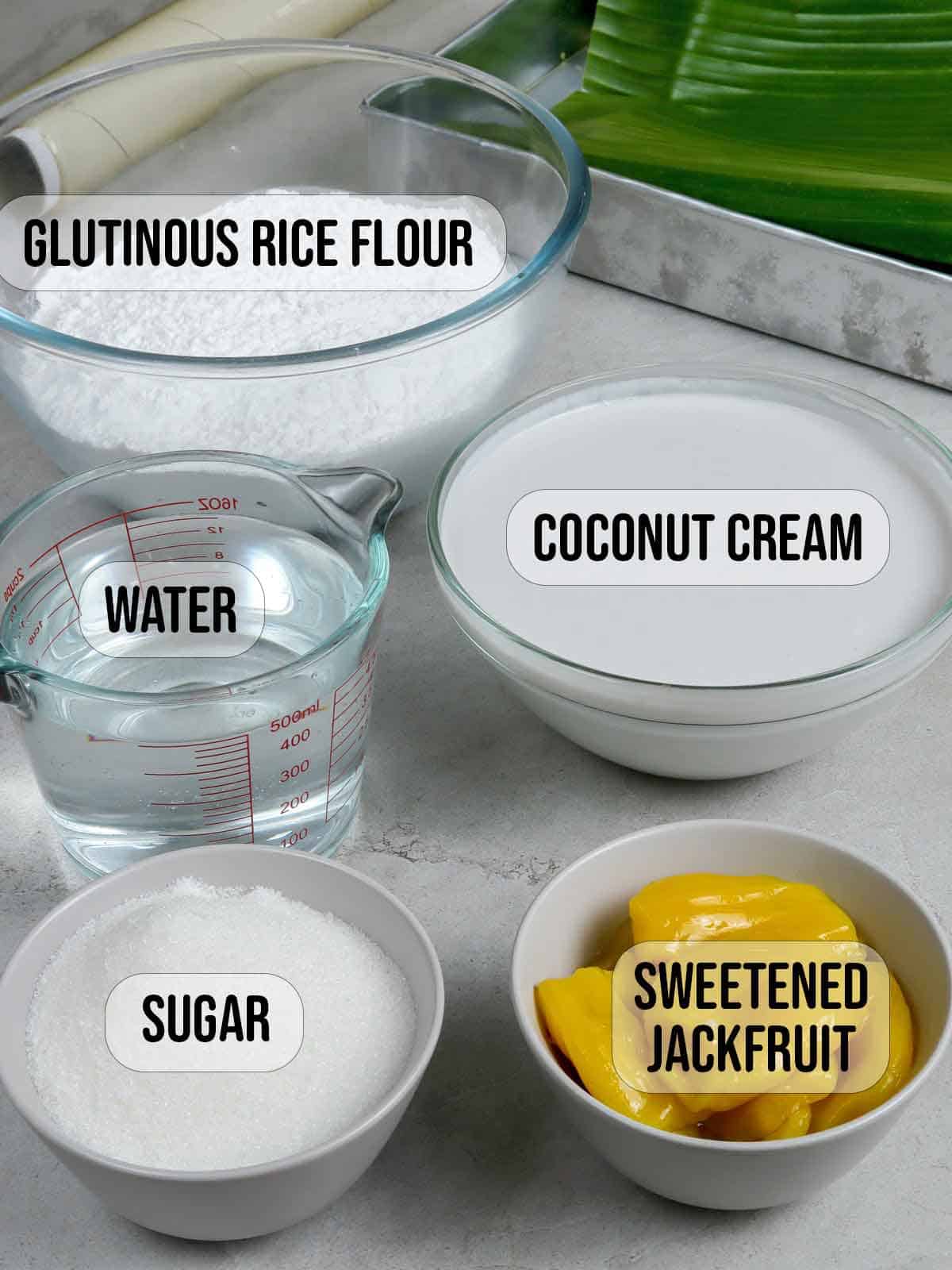 glutinous rice flour, coconut milk, sweetened jackfruit, latik, water, sugar in bowls.