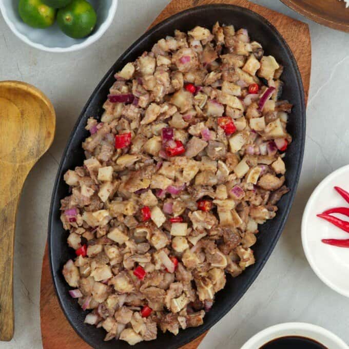 pork sisig on a cast-iron sizzling plate