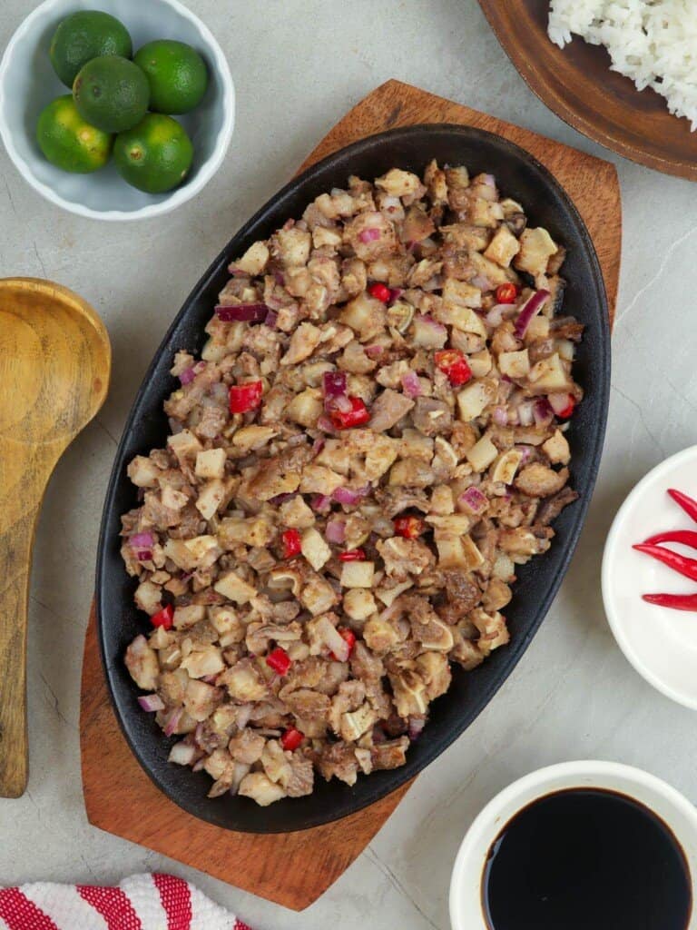 pork sisig on a cast-iron sizzling plate