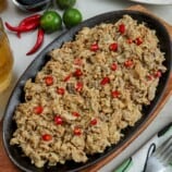 Chicken Sisig on a metal plate