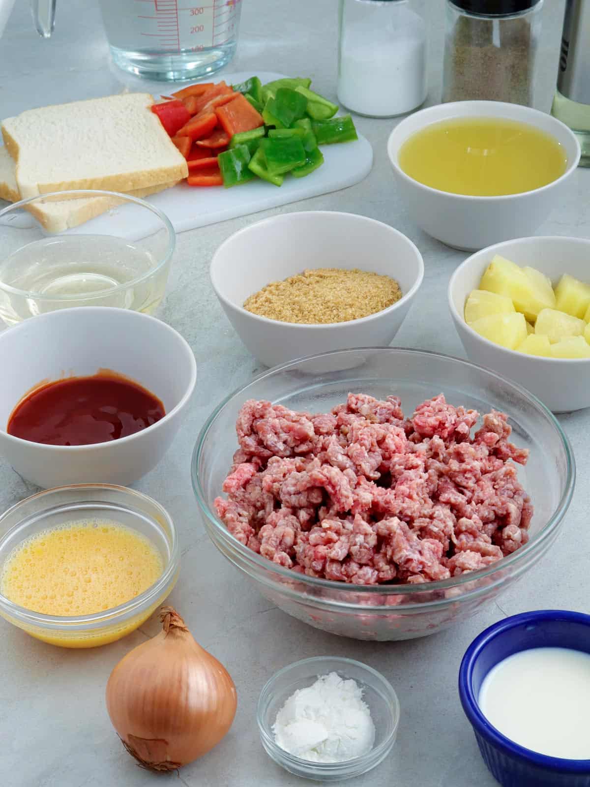 ground beef, pineapple chunks, bell peppers, milk, ketchup, sliced bread, onion, pineapple juice, ketchup, brown sugar