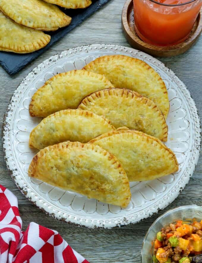 Filipino empanada with ground beef filling on a white plate