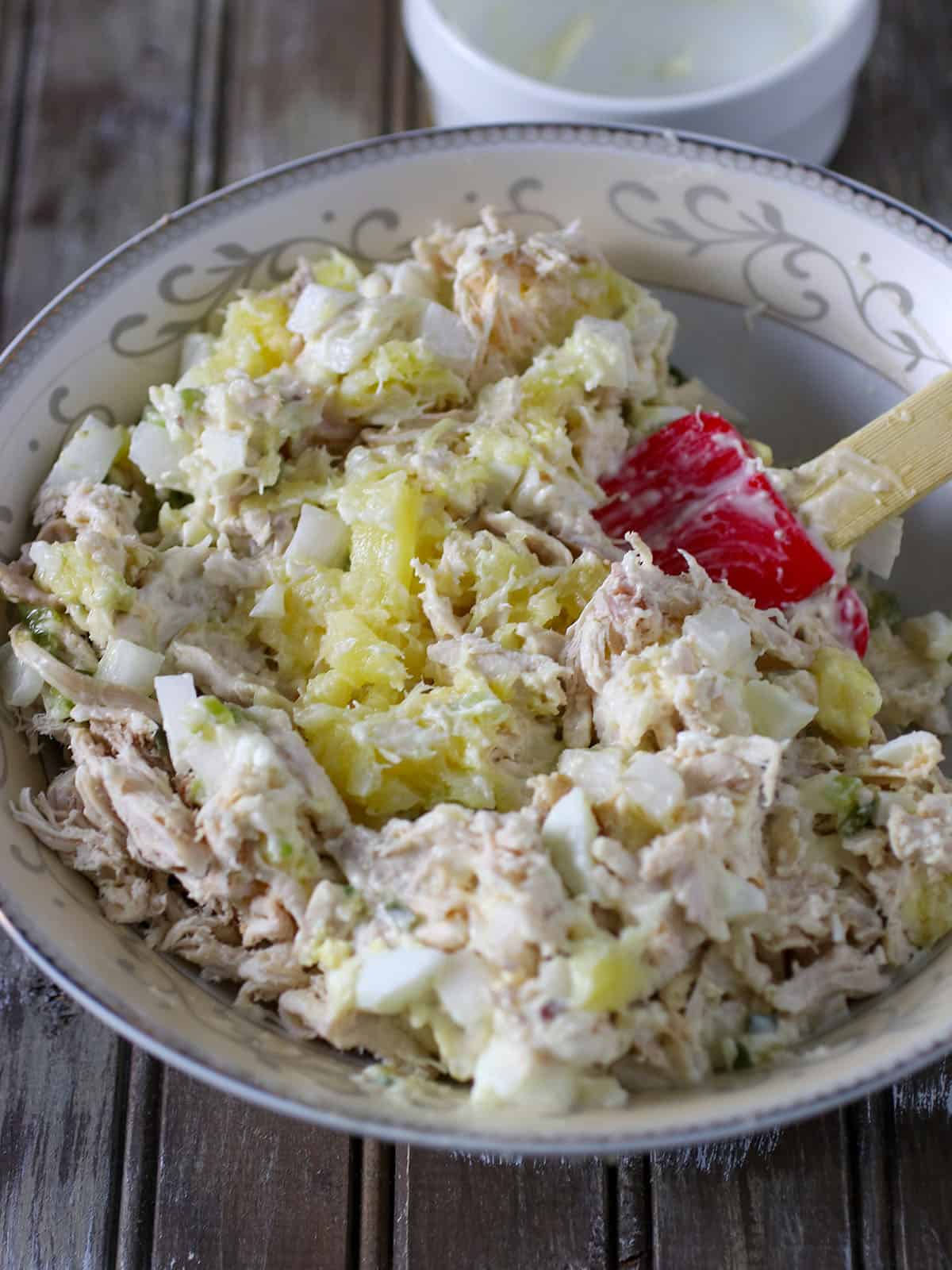 mixing chicken salad sandwich spread in a bowl