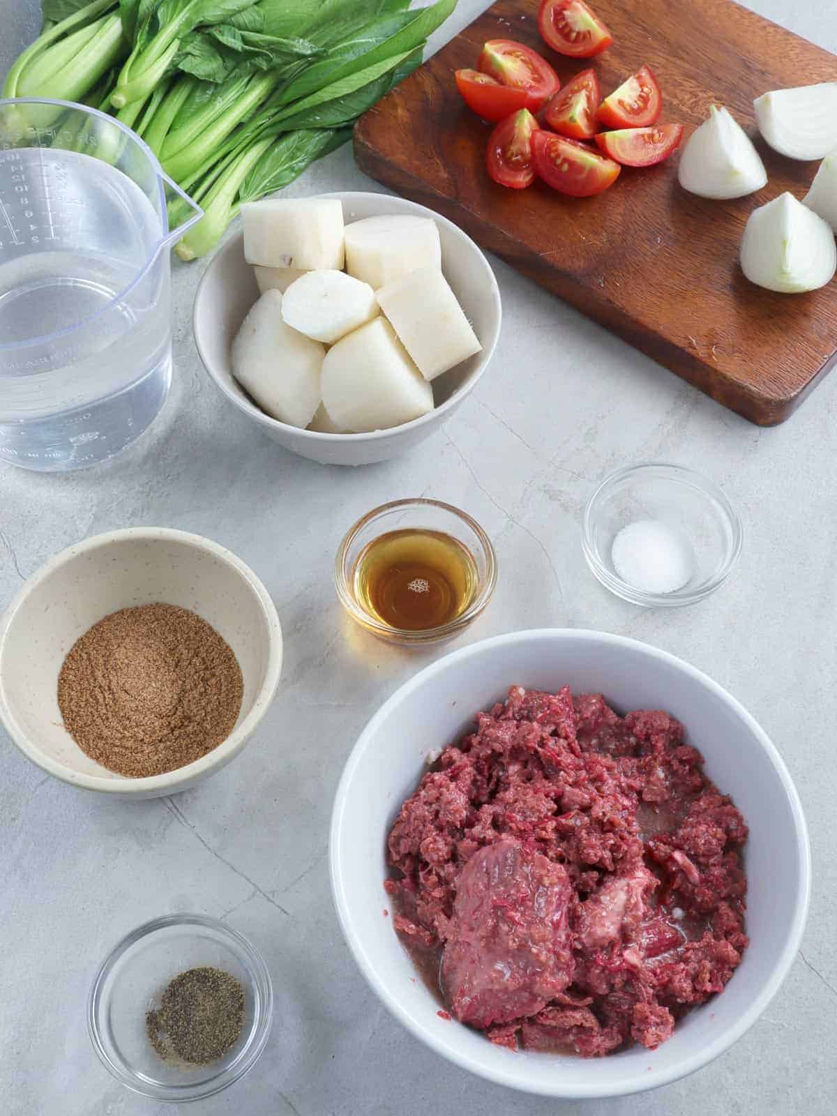 corned beef, radish, tomatoes, bok choy, tamarind powder, fish sauce, chopped tomatoes