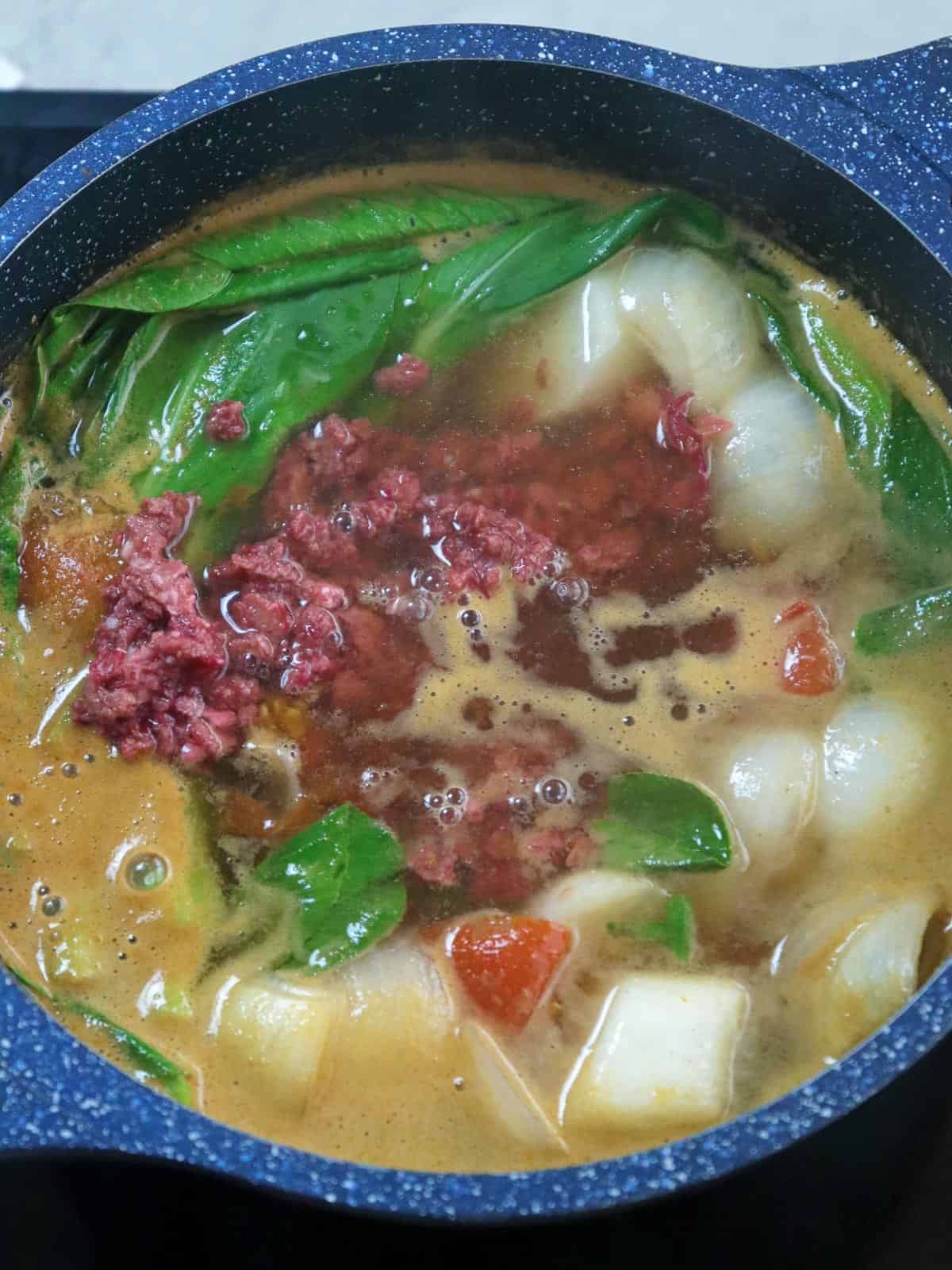 Corned Beef Sinigang in a soup pot