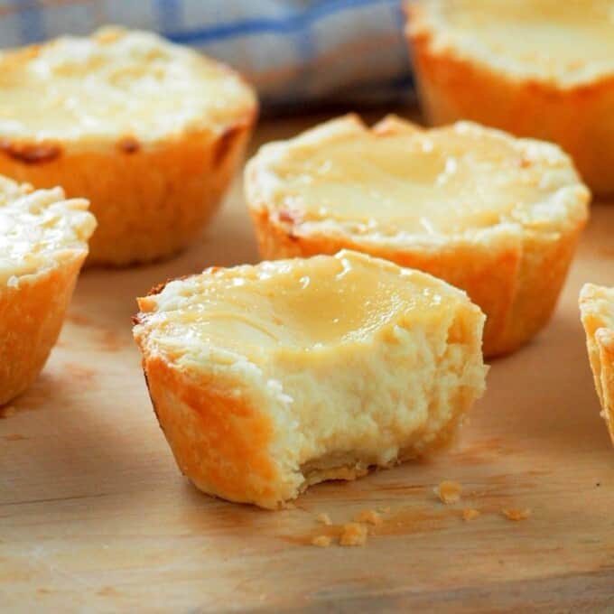 mini egg pies on a wooden board