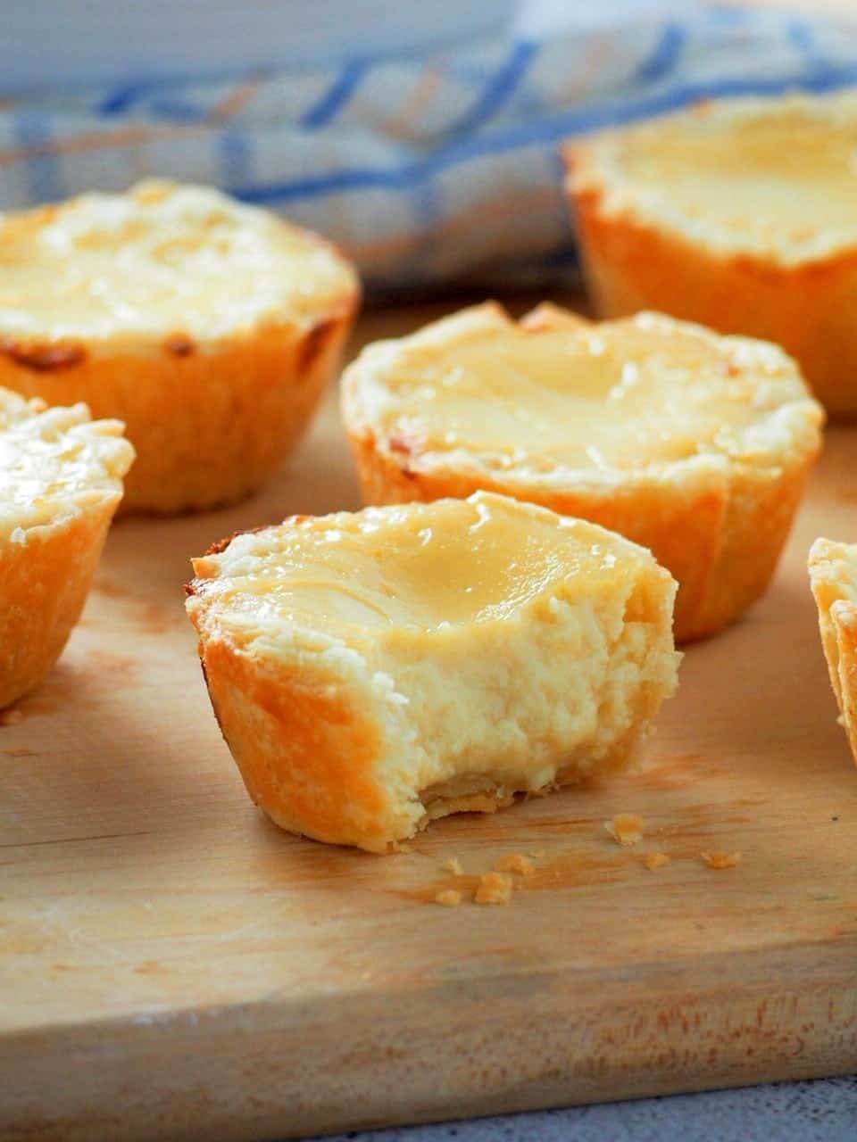 mini egg pies on a wooden board