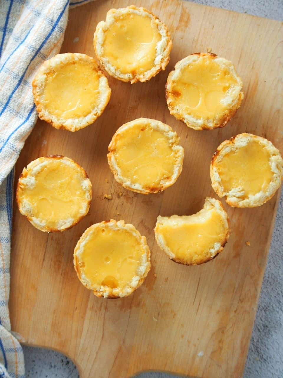 Mini egg pies on a cutting board