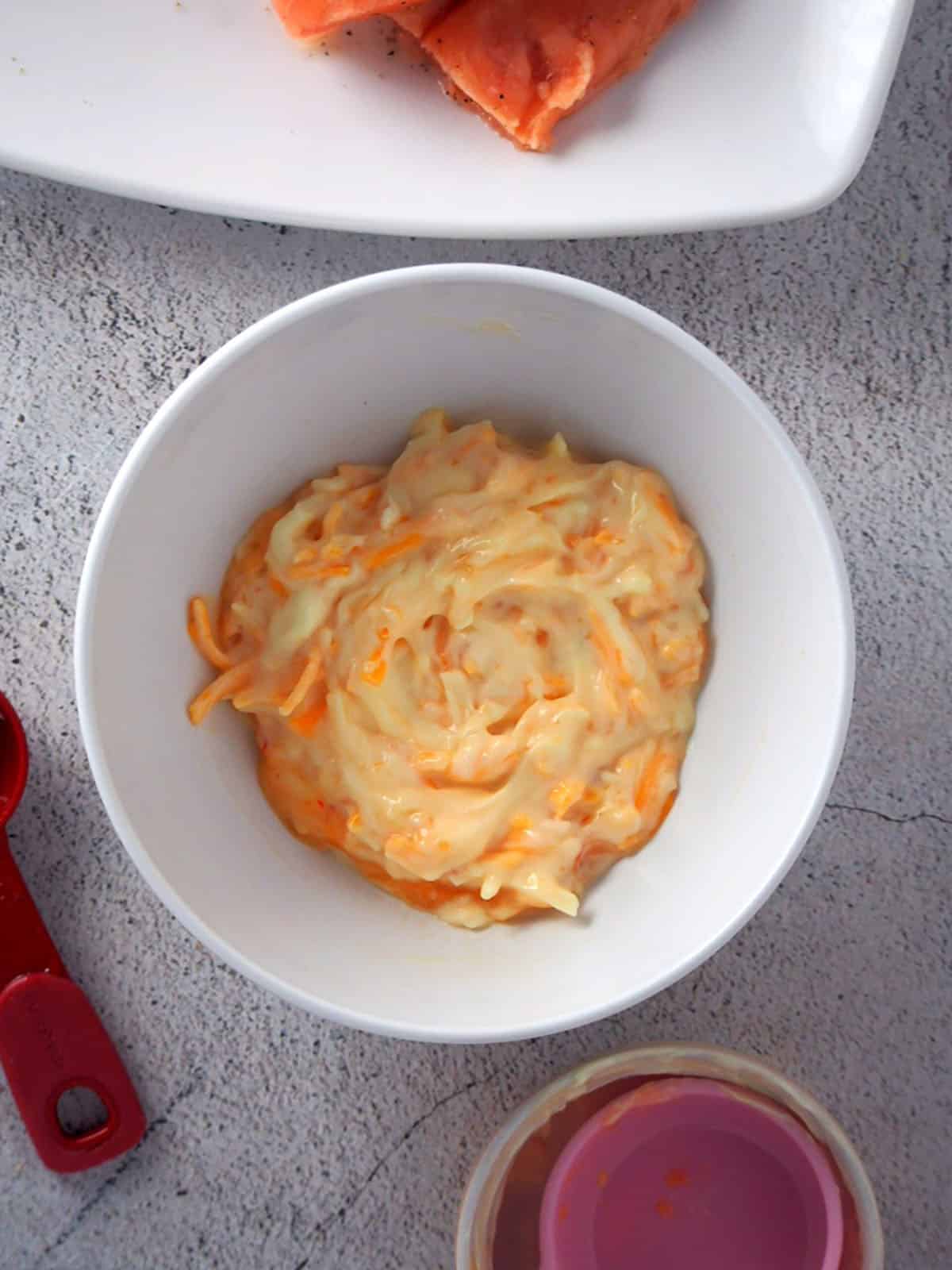 mayonnaise, cheese, and sweet chili mixture in a bowl