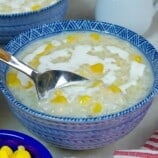 eating ginataang mais with a spoon.