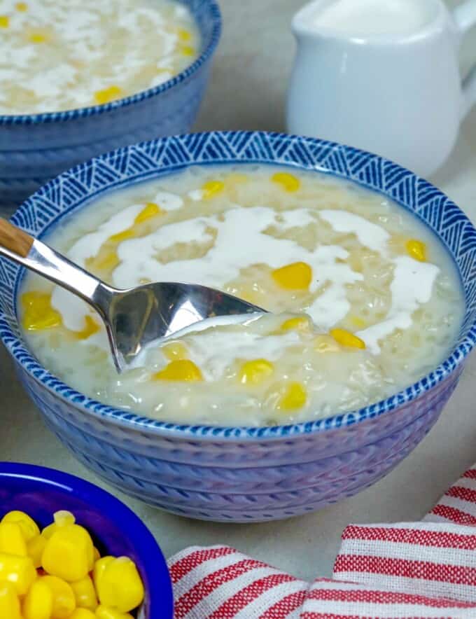 eating ginataang mais with a spoon.