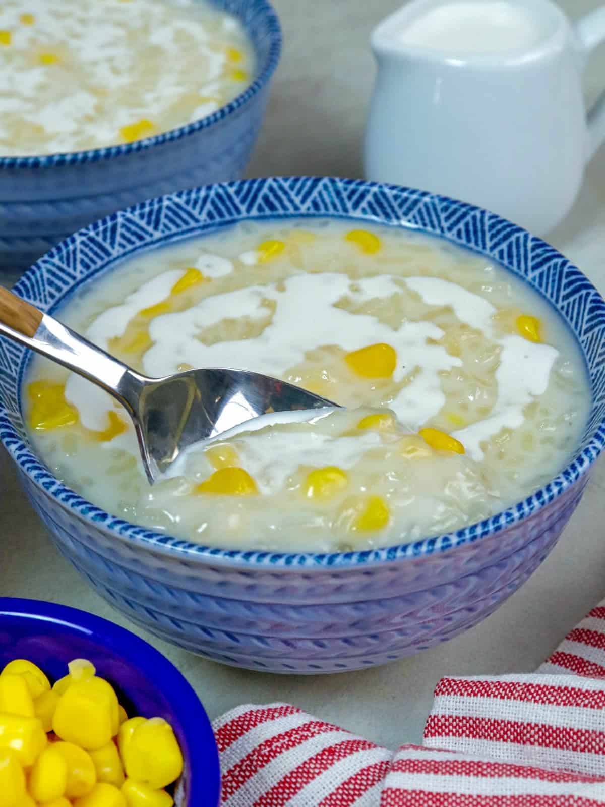 eating ginataang mais with a spoon