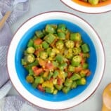 Curried Okra with Tomatoes in a blue bowl