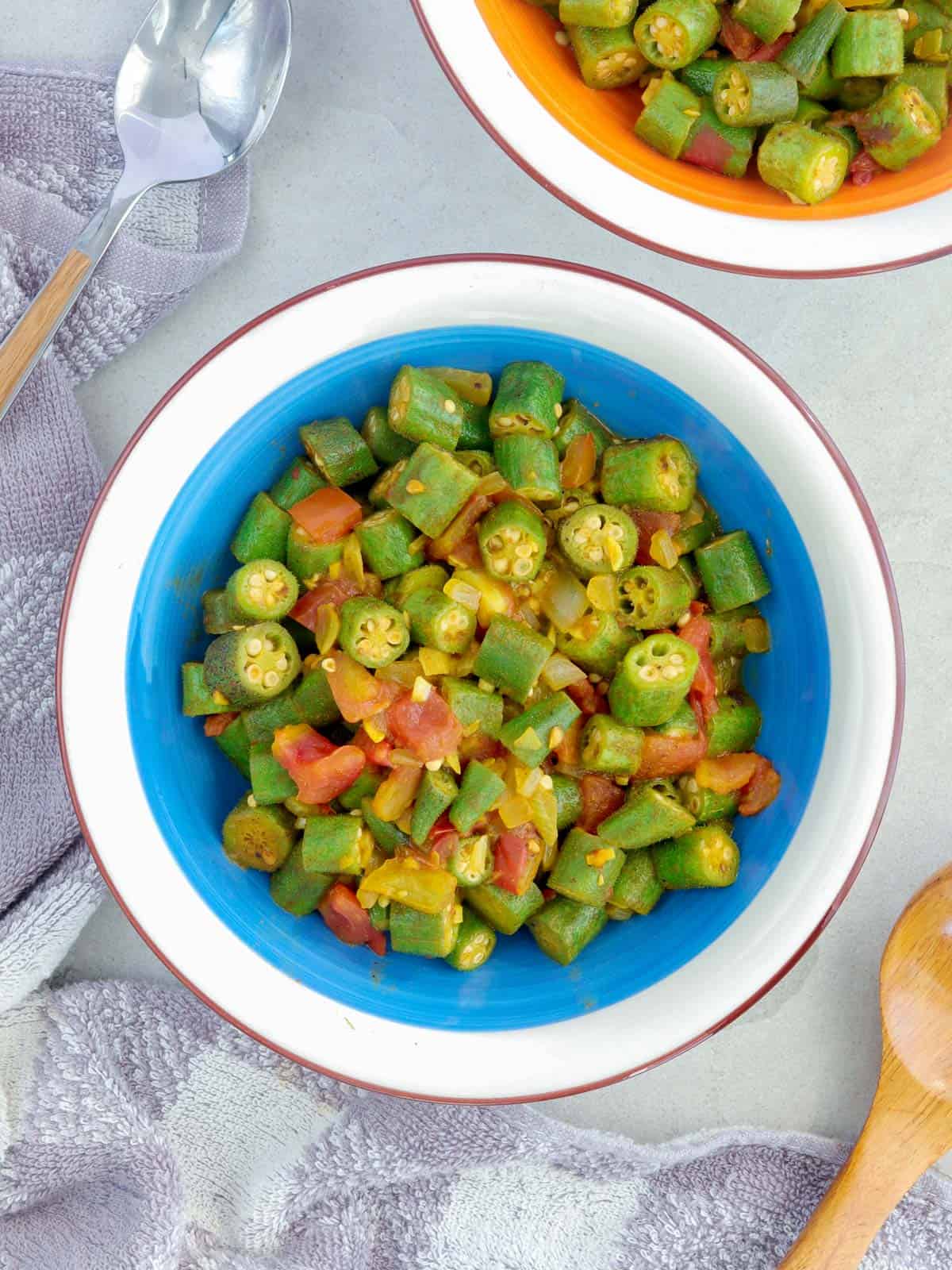 Curried Okra with Tomatoes in a blue bowl