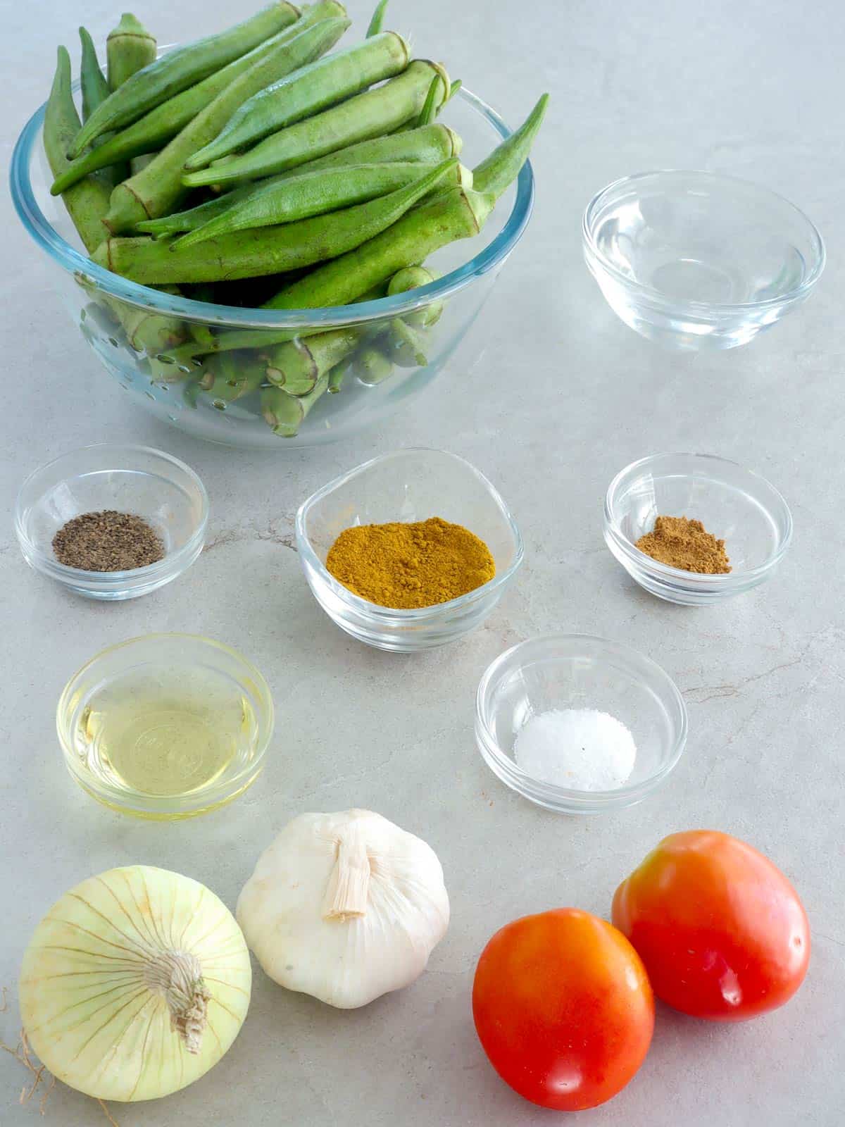 okra, tomatoes, curry powder, onions, garlic, salt, pepper, oil, water