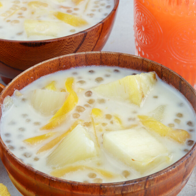 cassava in coconut cream with sago and jackfruit in wooden bowls