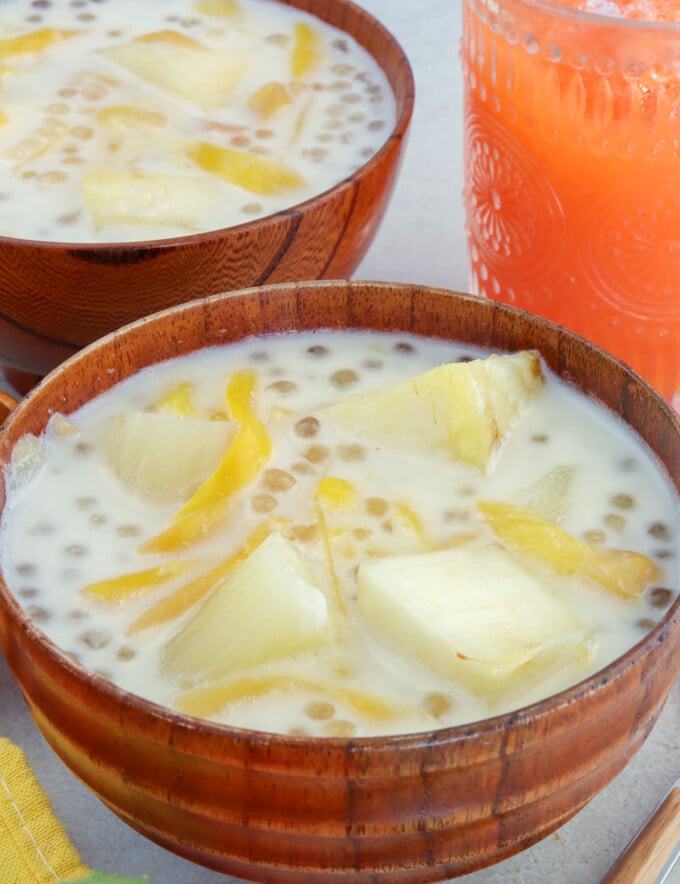 cassava in coconut cream with sago and jackfruit in wooden bowls