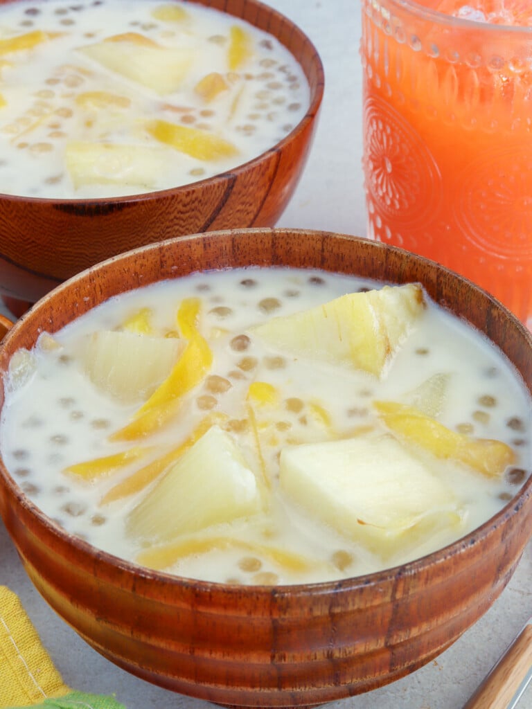 cassava in coconut cream with sago and jackfruit in wooden bowls