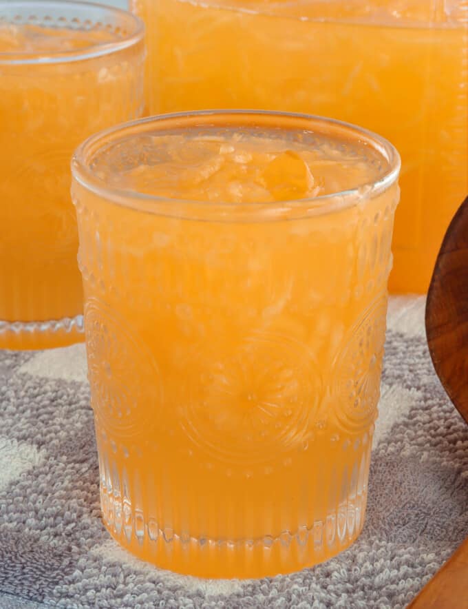 melon juice in a drinking glasses with ice