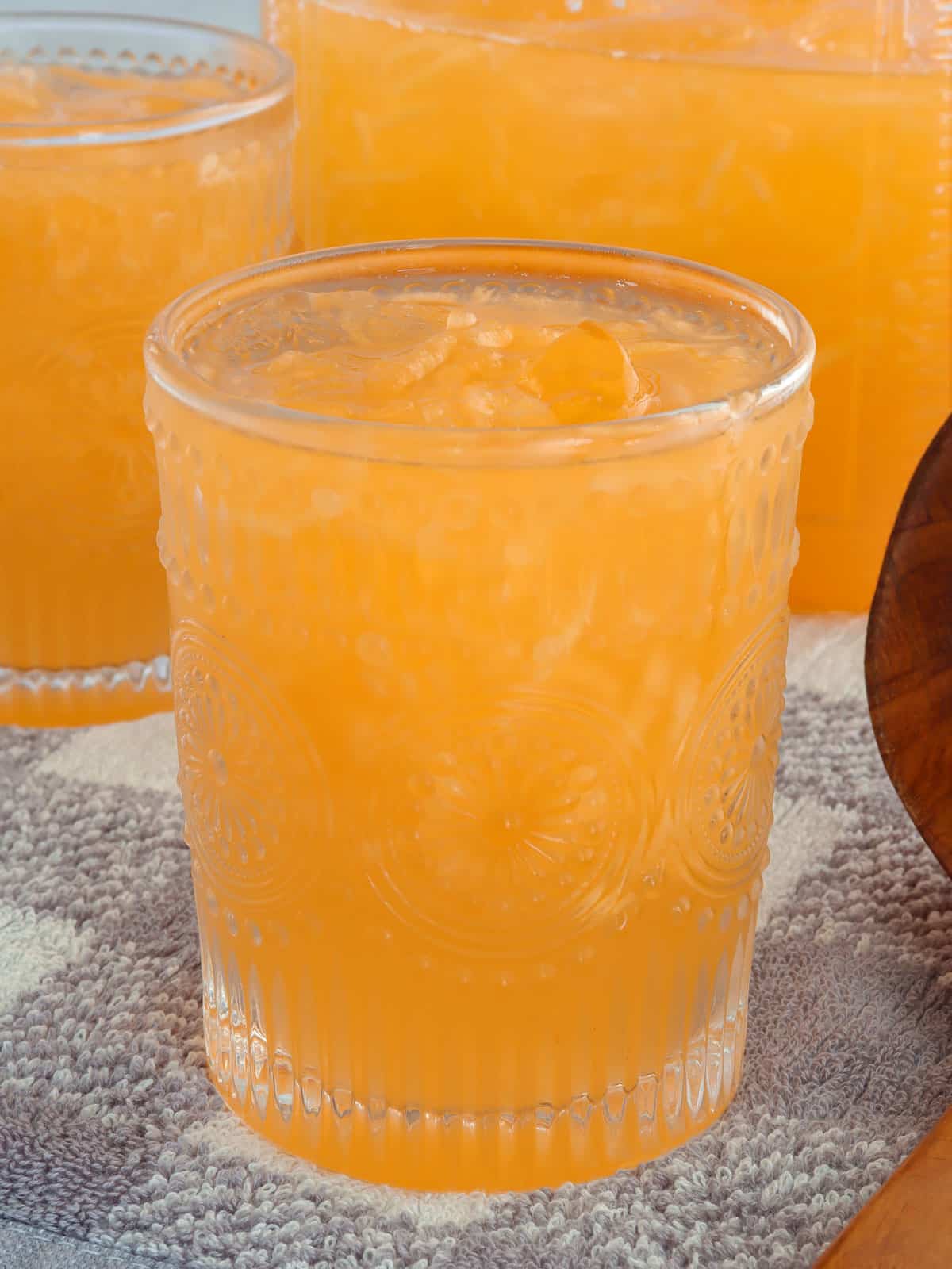 melon juice in a drinking glasses with ice