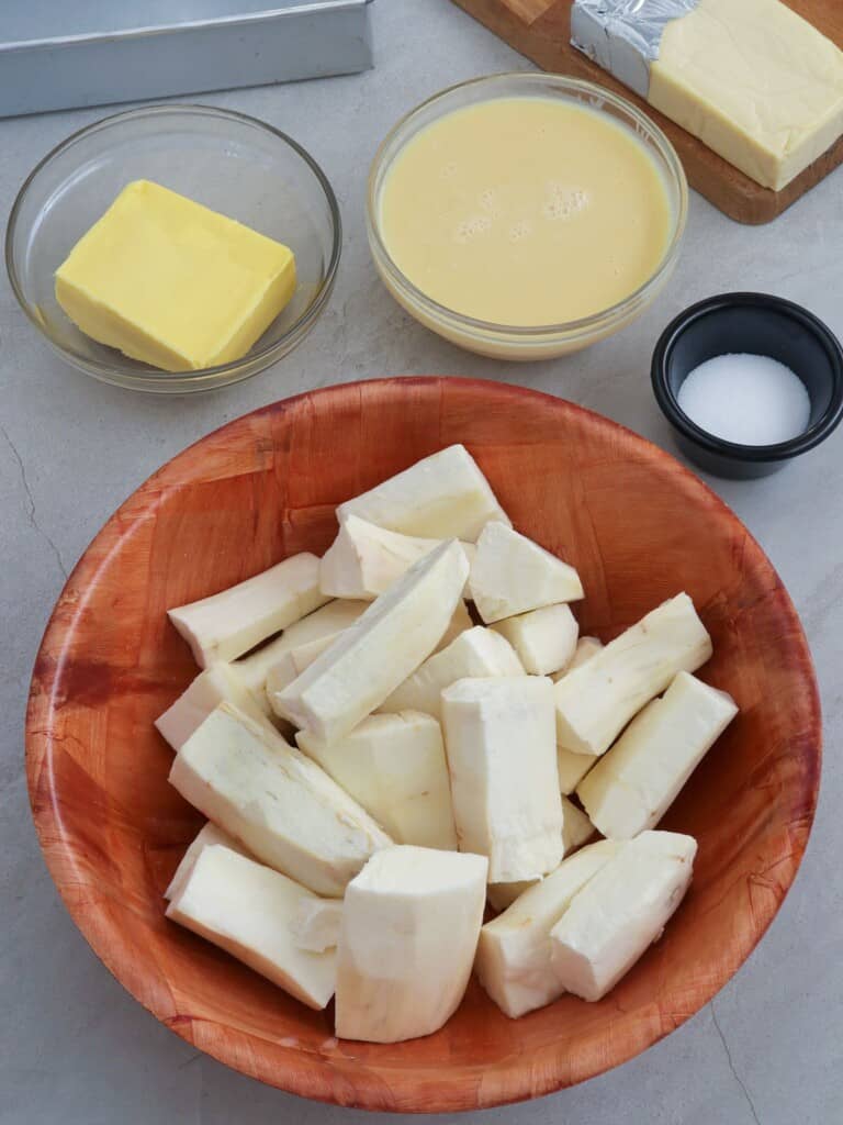 peeled cassava, butter, condensed milk, butter, shredded cheese
