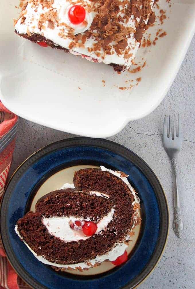 slice of black forest Swiss roll on serving plate